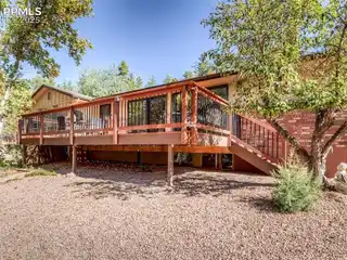 Custom Rancher Nestled Among Towering Pines