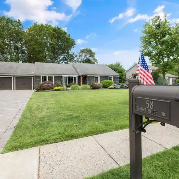 STUNNING COMMACK RANCH WITH DESIGNER UPGRADES