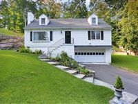 RECENTLY UPDATED CAPE COD HOME HIGH ON A KNOLL