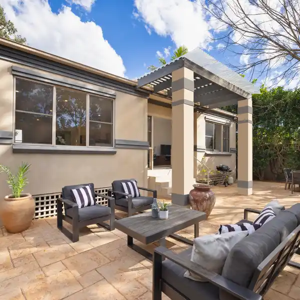SUN-FILLED SINGLE-LEVEL HOME WITH PRIVATE GARDENS