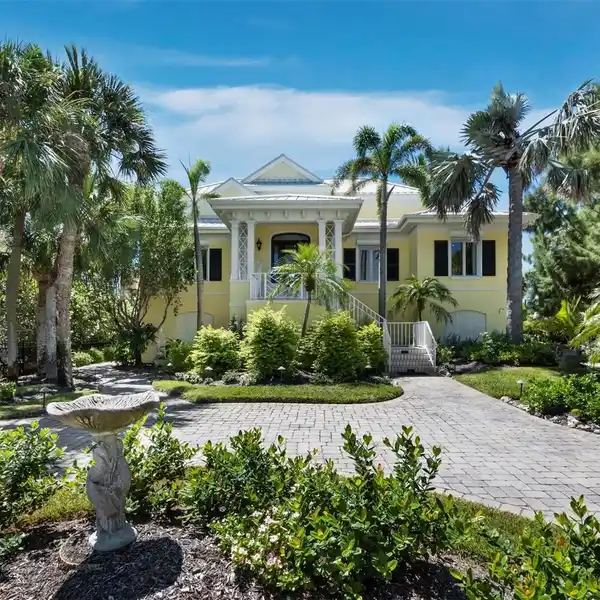 GULF-FRONT MASTERPIECE WITH BAYSIDE BOATHOUSE