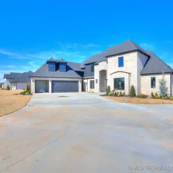 ONE-OF-A-KIND NEW CUSTOM HOME ON A LARGE LOT IN SOUTH BIXBY
