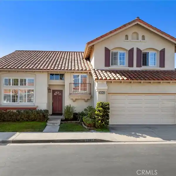 VAULTED PRIMARY SUITE WITH WALK-IN CLOSET AND SPA BATH