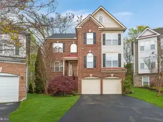 Elegant Brick-front Home with Scenic Backyard