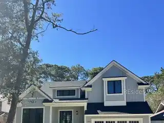 Golf Course Retreat Featuring Fireplace and Wood Ceilings