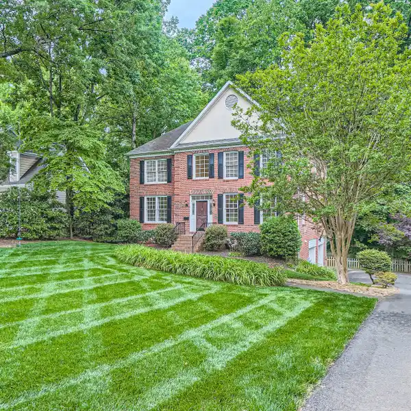 CHARMING BRICK HOME BACKING UP TO THE MYERS PARK GOLF COURSE