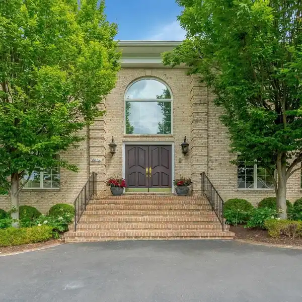 EXQUISITE BRICK COLONIAL ON A BEAUTIFUL ACRE