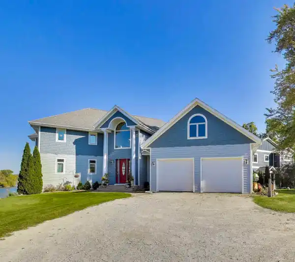 CUSTOM HOME WITH SWEEPING LAKE VIEWS
