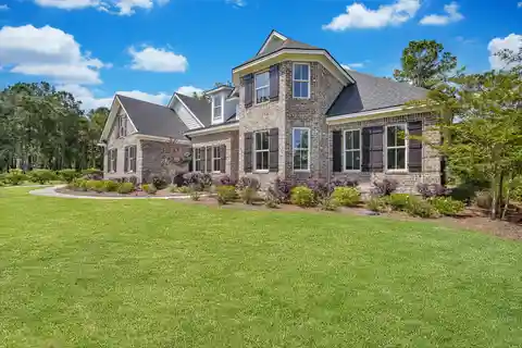 Stunning Brick Home with Custom Details, Serene Views, and Unfinished Bonus Space