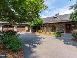 Two Homes, One Spectacular Estate: 9.39 Acres Overlooking Hayden Lake