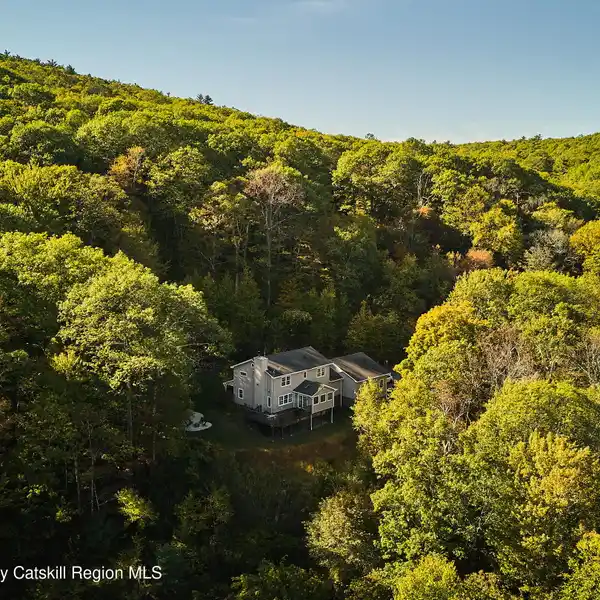 SERENE ESTATE SURROUNDED BY FOREST AND ROCK OUTCROPPINGS