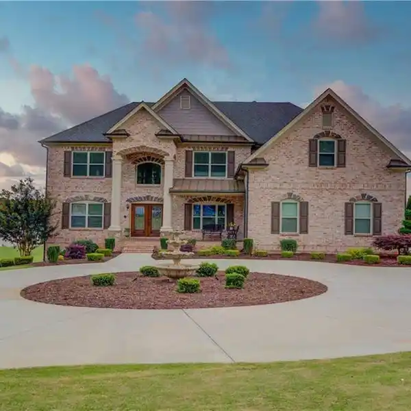 GRAND TWO-STORY FOYER WITH RICH HARDWOOD FLOORS