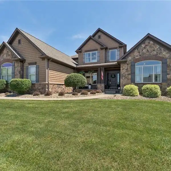 CUSTOM COMFORT IN COVETED COMMUNITY SETTING