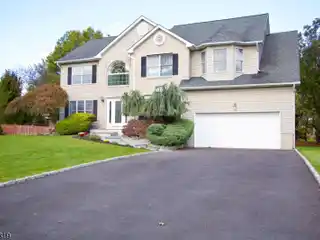 Elegant Colonial Featuring Modern Upgrades and Oversized Yard