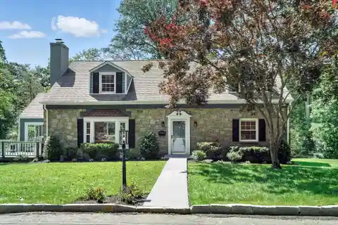 Meticulously Maintained and Turn-Key Cape Cod Style Residence