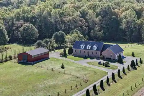 Custom Brick Retreat with Pool and Equestrian Barn