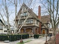 STUNNING LANDMARK TUDOR REVIVAL HOME COMPLETE WITH COACH HOUSE
