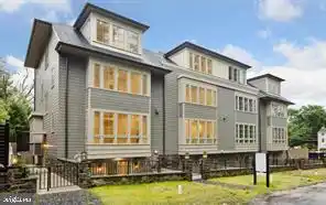 ELEGANT TOWNHOMES WITH PRIVATE COURTYARDS AND 2-CAR GARAGES