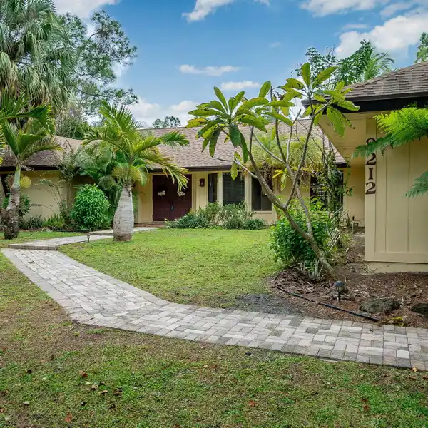 RARE CANAL-FRONT FIND IN PALM BEACH COUNTRY ESTATES