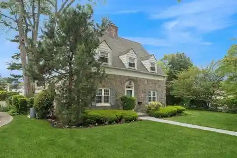 Surprisingly Spacious Stone and Brick Center-Hall Colonial