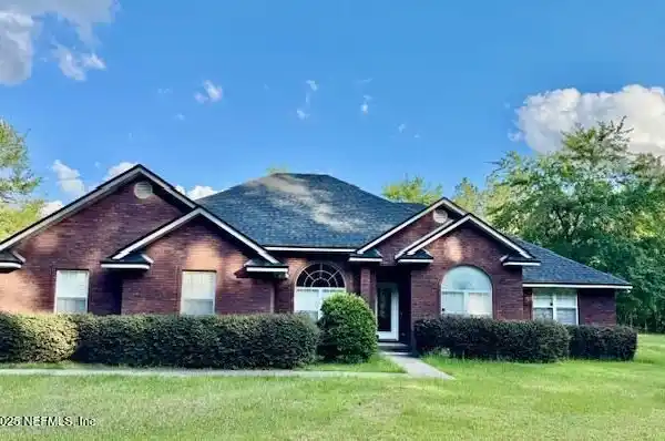 METICULOUSLY MAINTAINED SINGLE-STORY BRICK HOME ON 20 ACRES