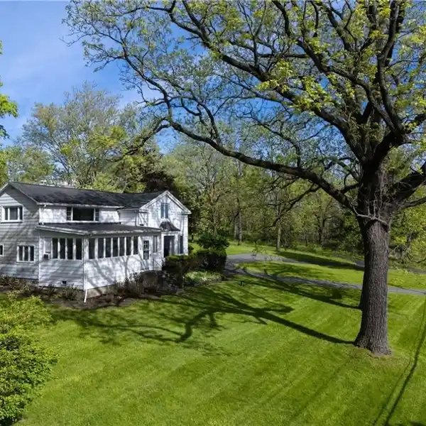 CHARMING FARMHOUSE ON EXPANSIVE PRIVATE LAKEFRONT