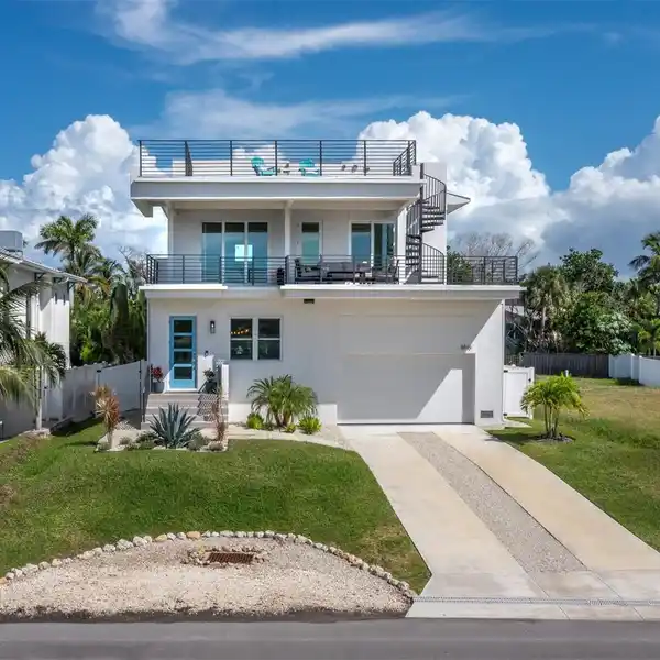 STUNNING LUXURY RETREAT IN HIGHLY SOUGHT AFTER VILLAGE OF LONGBOAT KEY