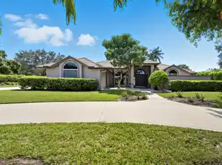 Elegant Gated Estate with Vaulted Light-Filled Interiors