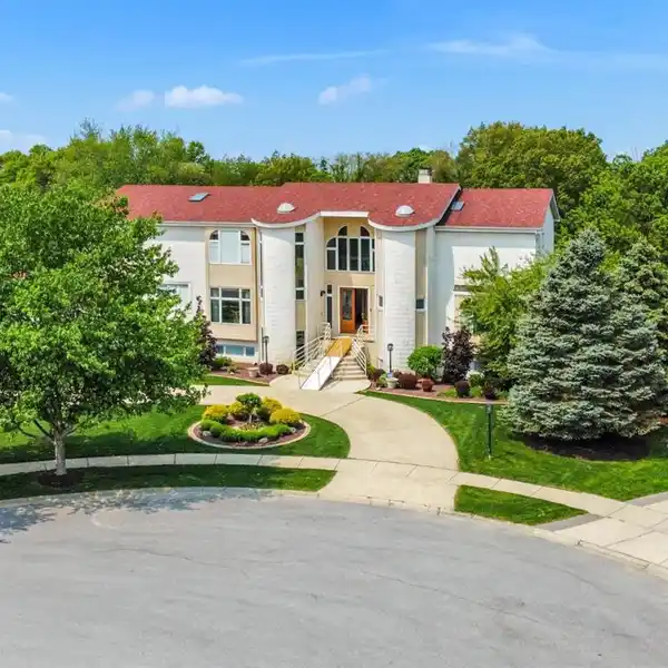 SPECTACULAR BRICK HOME ON A GORGEOUS TREE-LINED LOT