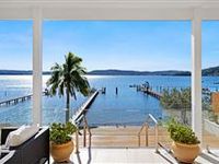 WATERFRONT LUXURY IN A BLUE-CHIP POSITION