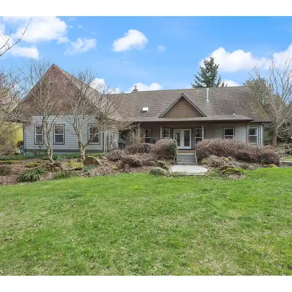 LIGHT-FILLED HOME IN A LUSH SETTING