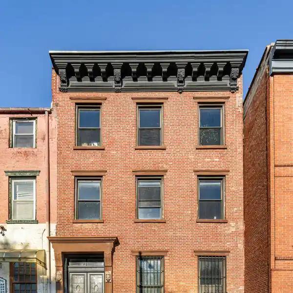 RARE AND REMARKABLE FOUR-FAMILY BROWNSTONE