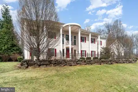 Stunning Colonial Masterpiece Nestled on a Sprawling Lot
