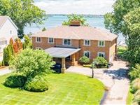 SPACIOUS AND ELEGANT BRICK RIVERFRONT RESIDENCE