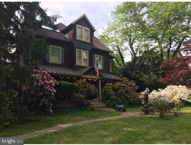 Victorian Beauty Surrounded by Gorgeous Gardens