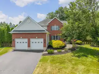 Elegant Colonial with Covered Porch and Deck