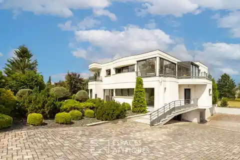 Spacious Home Surrounded by Private Wooded Grounds