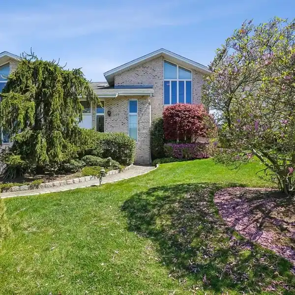 TIMELESSLY ELEGANT CENTER HALL COLONIAL