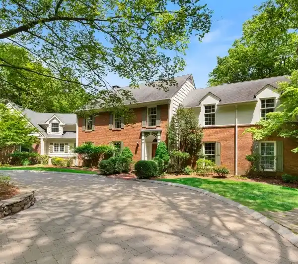TIMELESS COLONIAL NESTLED ON SERENE ACREAGE