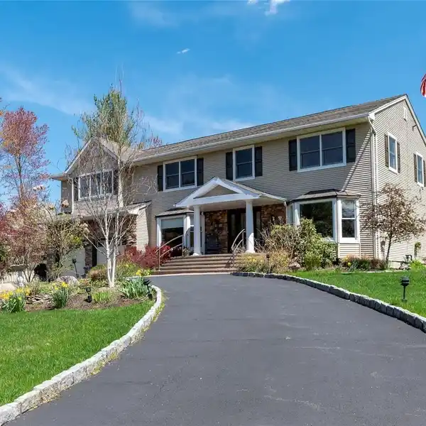 LUXURIOUS AND COMFORTABLE COLONIAL HOME ON A SERENE ACRE