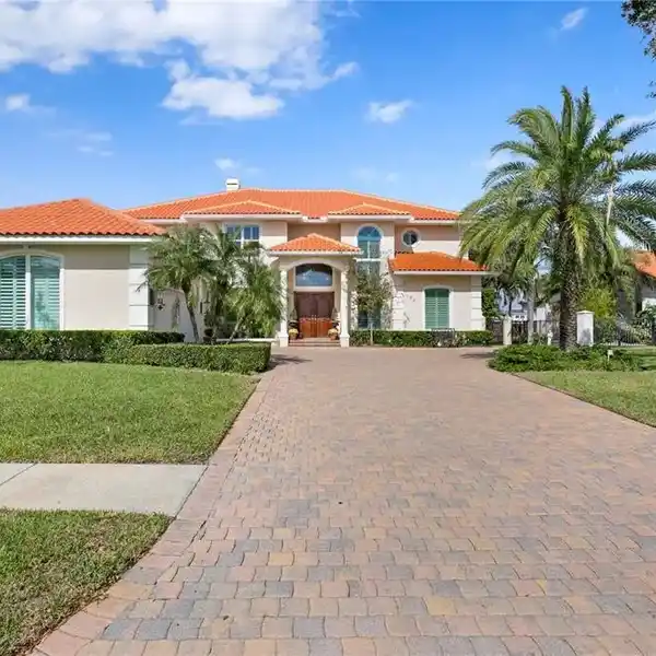 STUNNING WATERFRONT PROPERTY WITH PRIVATE DOCK AND LIFT