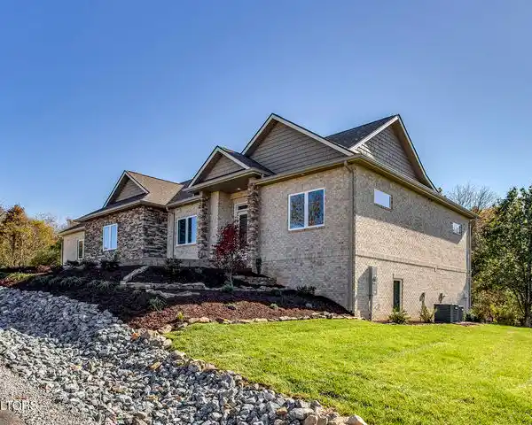 BEAUTIFULLY DESIGNED ALL-BRICK AND STONE NEW CONSTRUCTION