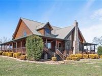 82-ACRE HILLTOP FARM WITH TWO LUXURY LOG HOMES