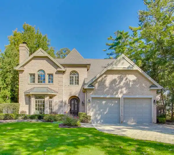 CUSTOM ALL-BRICK RETREAT IN COVETED GLEN OAK ACRES