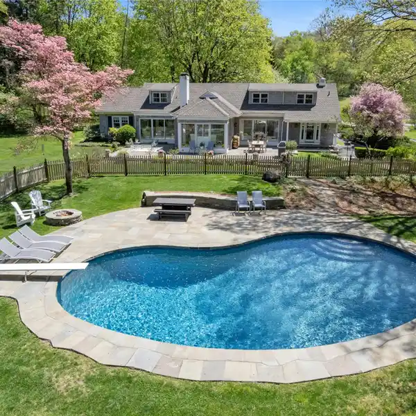 HAMPTONS-ESQUE CAPE COD ON VERDANT PROPERTY