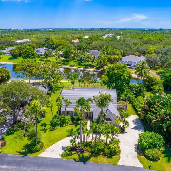 PEACEFUL LAKEFRONT HOME WITH SOARING CEILINGS