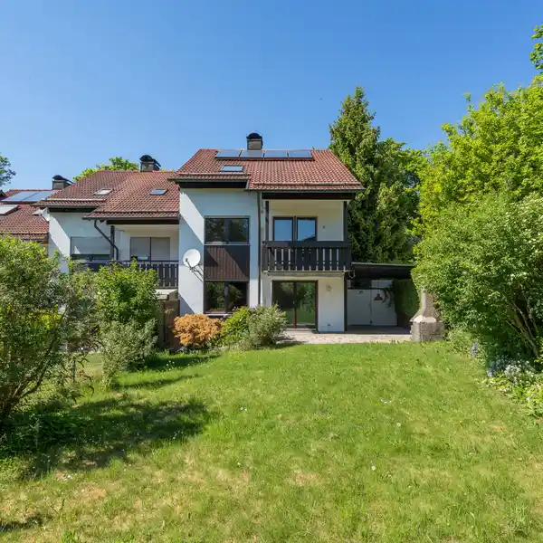 WELL-MAINTAINED CORNER HOME IN IDYLLIC SETTING