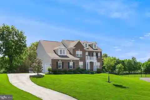 Sun-Filled Colonial on Private Wooded Lot