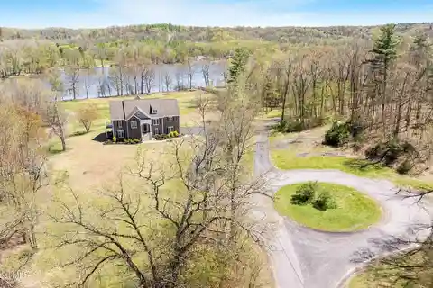Comfortable Riverfront Living on over Three Acres