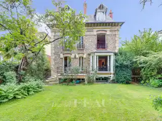 Stone Home with Lush Garden